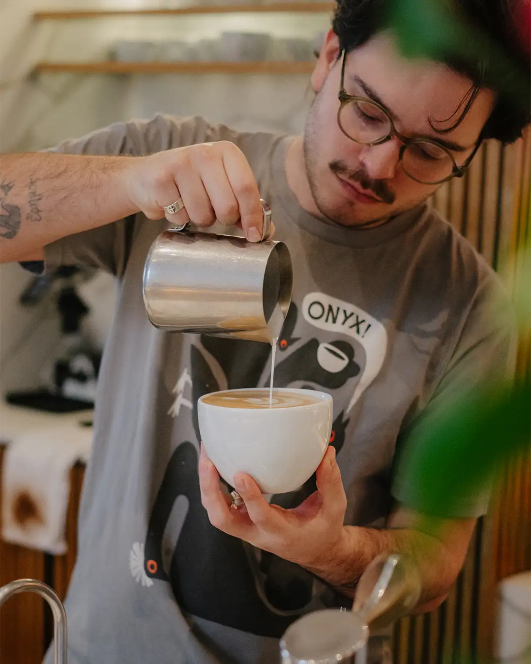 Barista pouring latte art